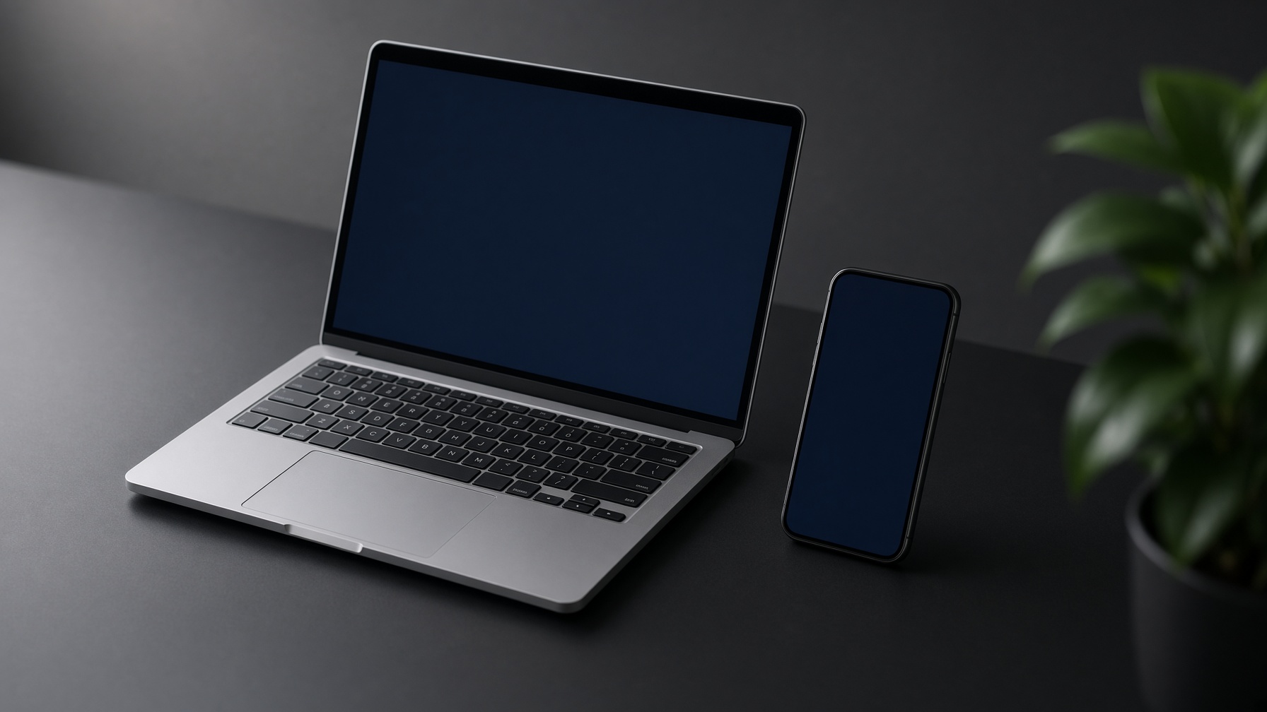 Laptop and phone on a studio desk
